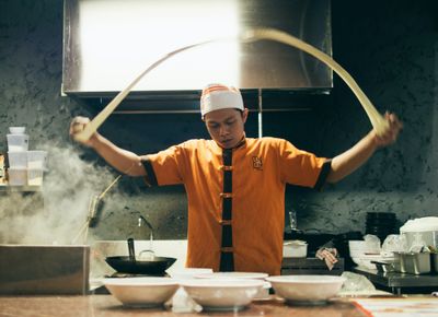 man in a kitchen preparing food